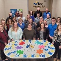 BLC Community Bank employees posing with helping hands table