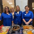 BLC Community Bank employees serving food