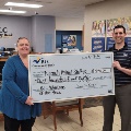 BLC Community Bank employee presenting check to Neenah Animal Shelter