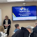 BLC Community Bank employees teaching fraud prevention class